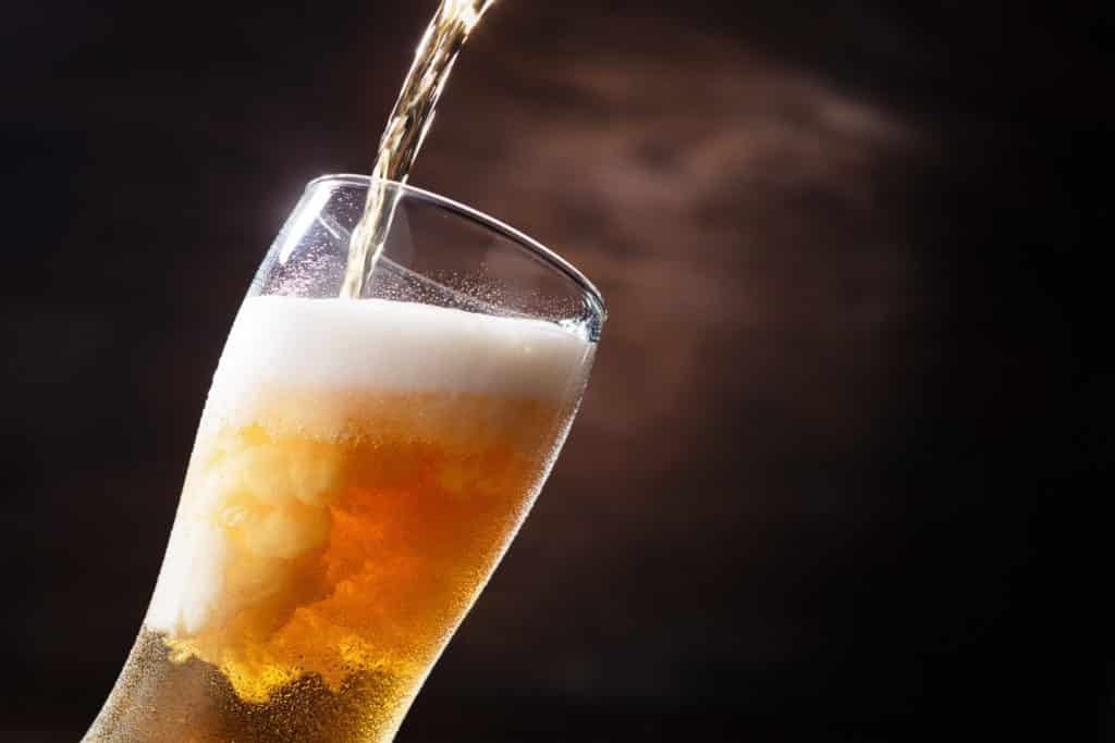 Beer-being-poured-from-tap-into-beer-glass